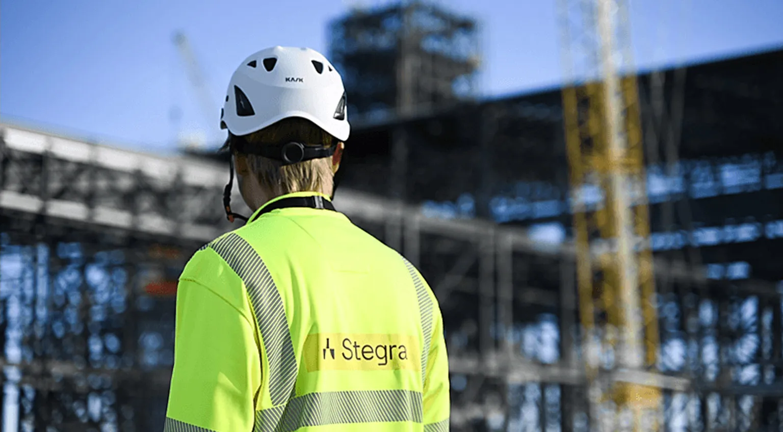 A Stegra employee looking out over the plant
