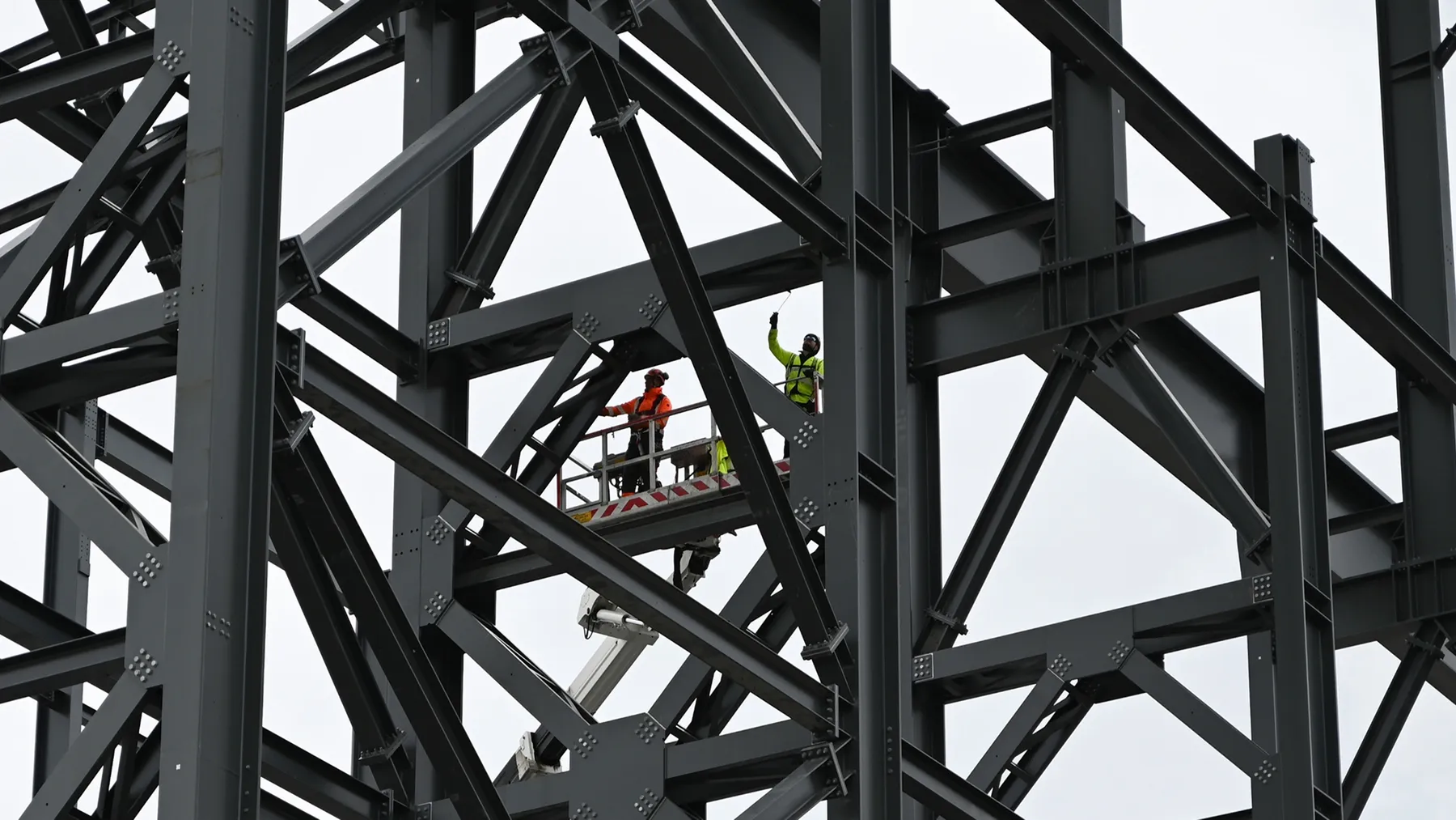 A team working on a tall steel structure