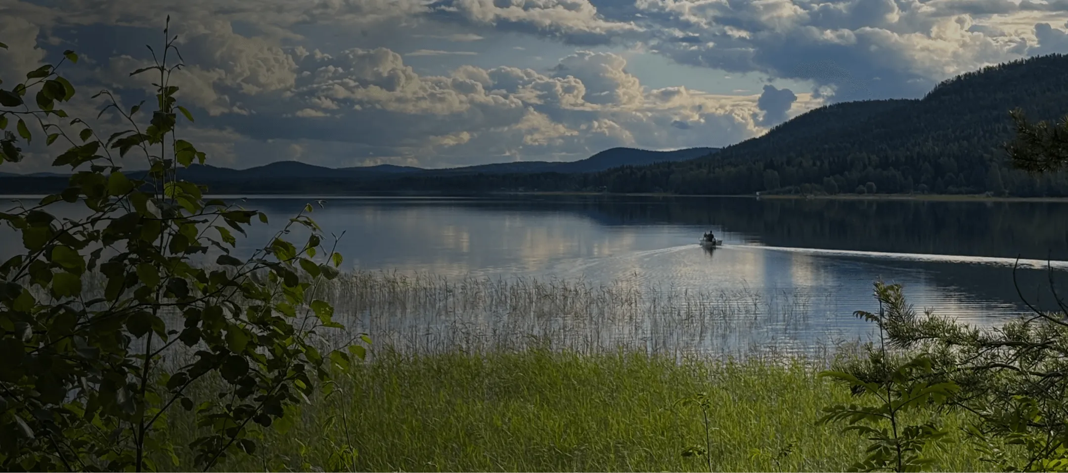 Landscape of a lake with hills in the background